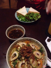 Vegetables with rice noodles and a tuna sandwich