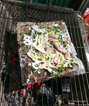 Bánh tráng nướng đầy đủ nem, bắp cải, hành, trứng cút, mắm ruốc, sa tế