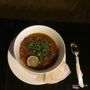 Magrib tomato soup. Originally from Morocco. Tomatoes, rich spices and herbs, olives, lemon, lavash bread.