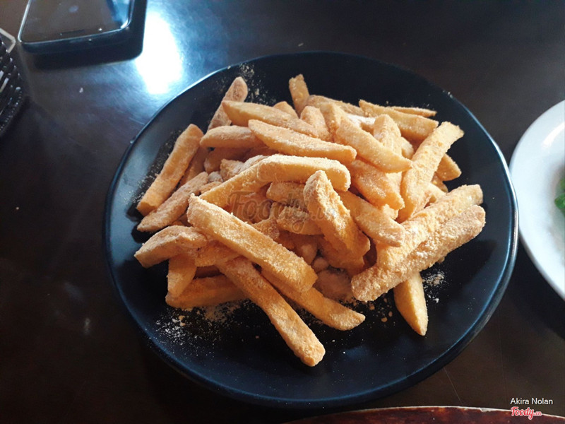 Fried potatoes shaking with cheese